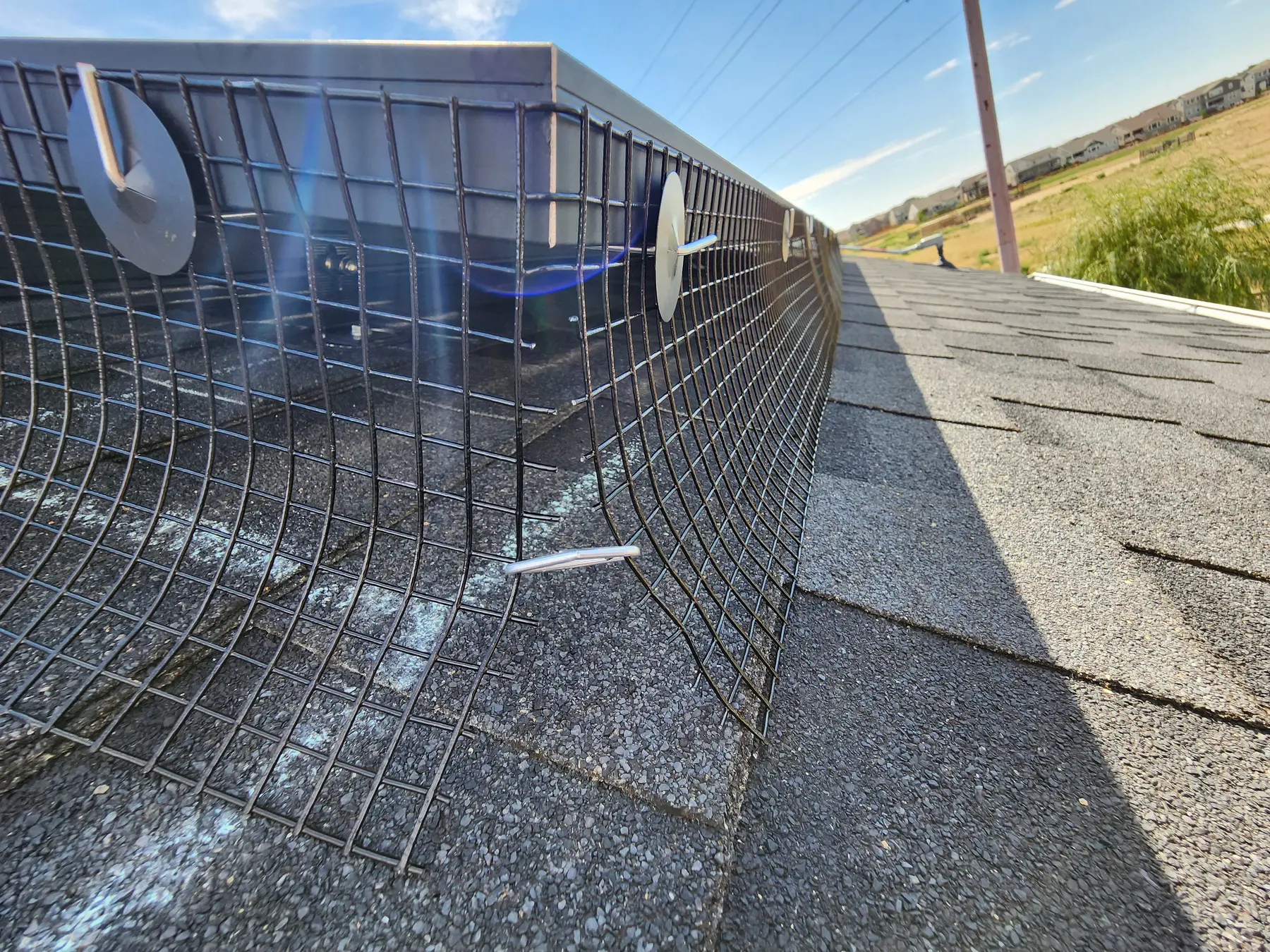 Critter guard installed around a residential solar array for Christian D. in Erie, Colorado