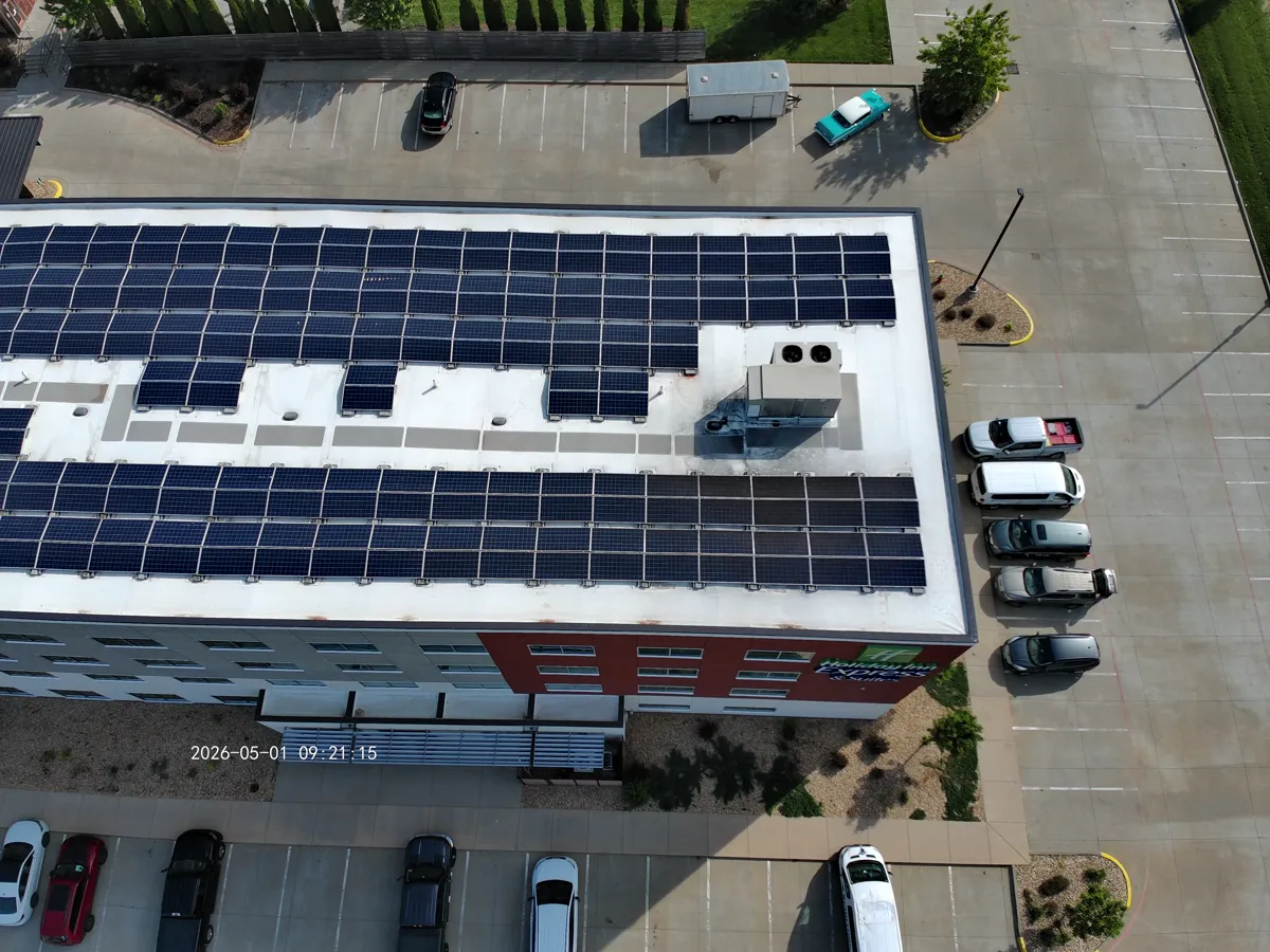 Hotel rooftop solar array aerial image